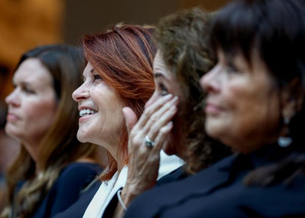 Arkansas Governor Sarah Huckabee Sanders, Rosanne Cash, Tara Cash Schwoebel, and Kathy Cash-Tittle attending the unveiling of Johnny Cash's statue at the U.S. Capitol, Washington, in September 2024