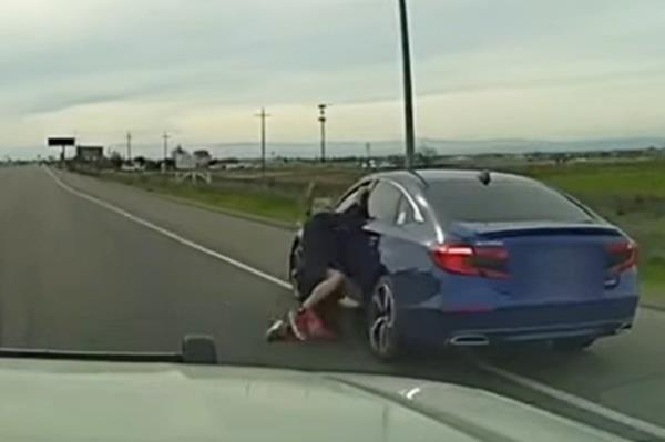 Juan Valdez clinging to a car.