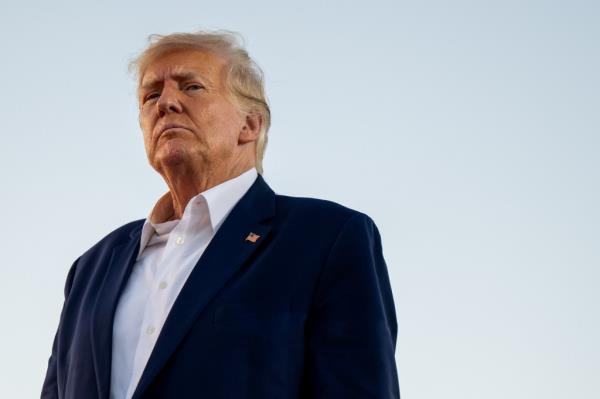 President Do<em></em>nald Trump looks on during a rally at the Waco Regio<em></em>nal Airport on March 25, 2023 in Waco, Texas.