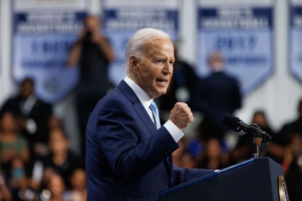 U.S. President Joe Biden delivering a speech a<em></em>bout lowering costs for Americans at a podium at Prince George's Community College, Maryland