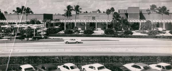 Black and white vintage photo of Bal Harbor 60th anniversary celebrations with floral installations and luxury brand experiences at the Bal Harbour Shops