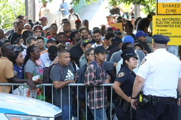 Dozens of tents and (a<em></em>bout) a hundred migrants are camped along the bike path on the west side of Randall's Island near the Ward's Island pedestrian bridge and the City-run mirgant shelter on August 14, 2024