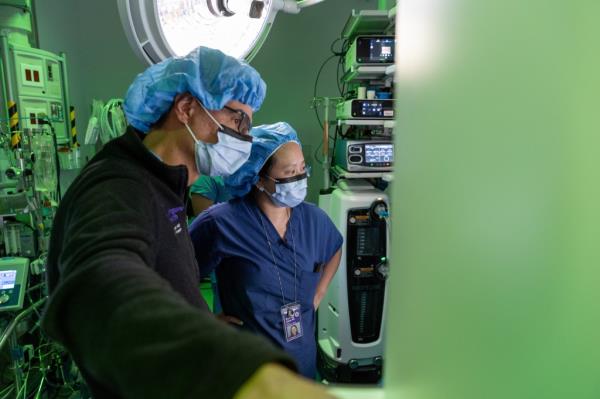 Chang, right, was recently lauded for leading the first fully robotic lung transplant in the nation, using the novel technique to replace a man's right lung.