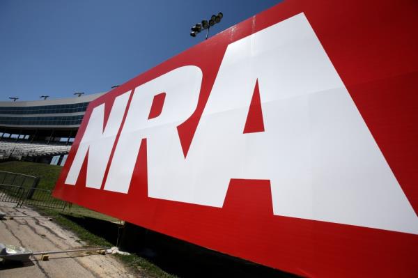 Large red NRA sign with white text outside the track of the NASCAR Sprint Cup series