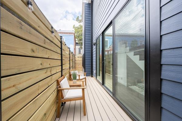 A sundeck is surrounded by privacy fencing.