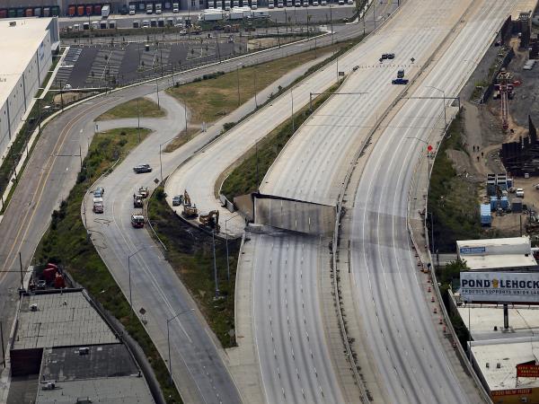 Pictured, the northbound overpass collapsed and the subsequent damage to the southbound lanes. 