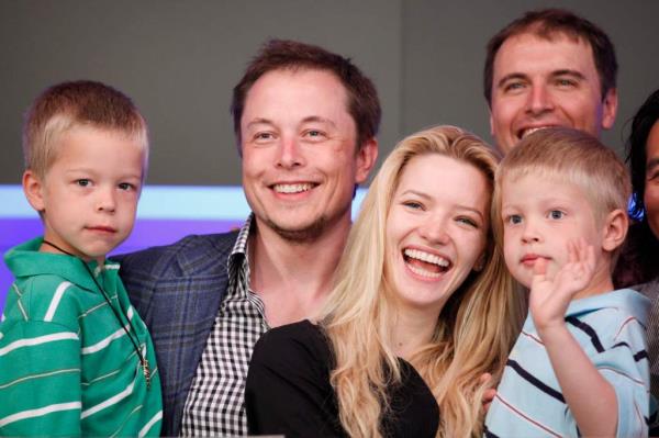 Elon Musk, CEO of Tesla Motors, stands with his fiancee Talulah Riley and his twin sons Griffin, left, 6, and Xavier at the Nasdaq's opening bell to celebrate the electric automaker's initial public offering, Tuesday, June, 29, 2010, in New York. 