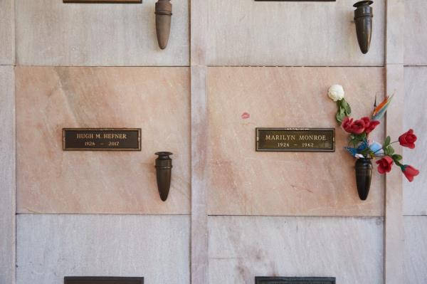 Playboy magazine publisher Hugh Hefner, who never met Monroe, but put her on the cover of the first issue, purchased the crypt to the immediate left of her in 1992.  A photo of those crypts.