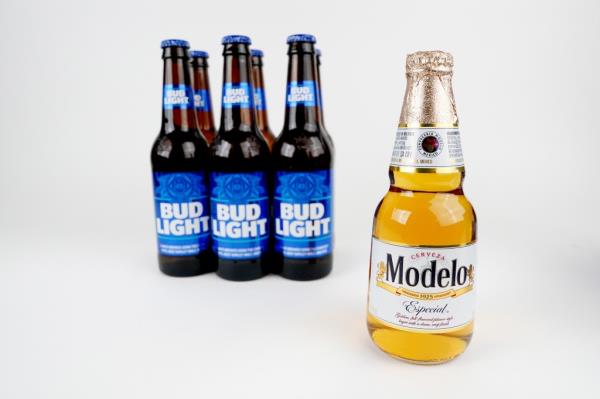 A Modelo Especial bottle in front of six Bud Light bottles.