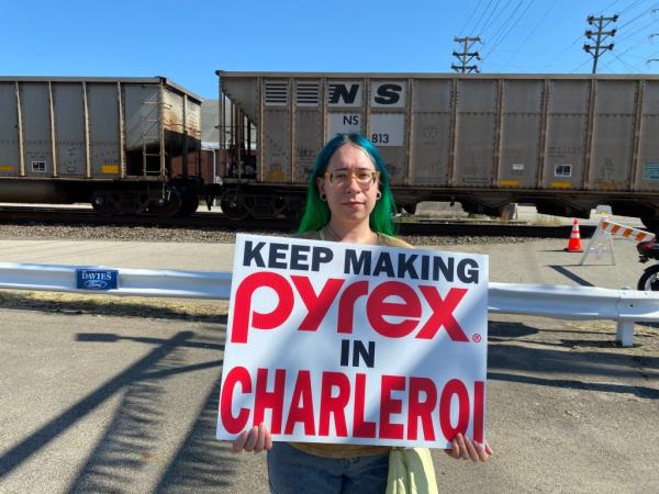 Erin Guzik holds a sign 