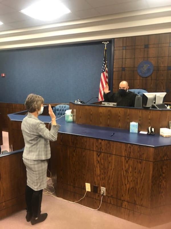 Judge Michael Valentine admiisters the swearing in for newly reelected court officials in Edwards County Court on Dec. 1, 2020.