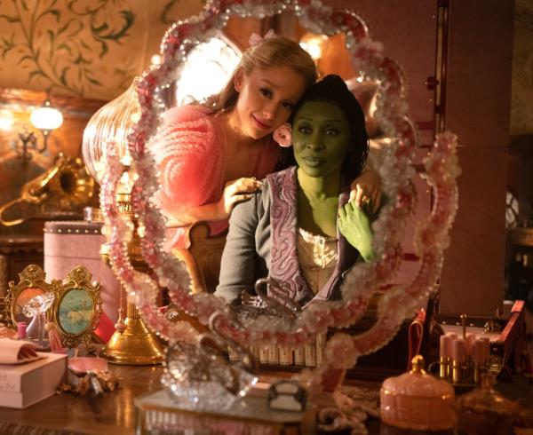 Ariana Grande as Glinda and Cynthia Erivo as Elphaba in a scene from the film 'Wicked'