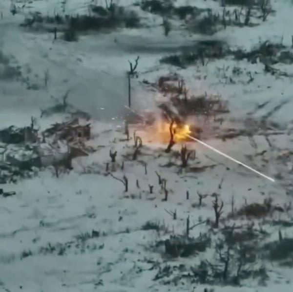 Russian tank under fire in Ukraine.