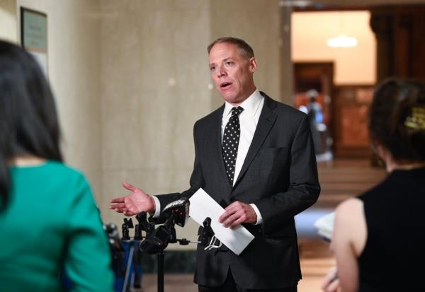 Will Barclay at a press co<em></em>nference inside a NYS Capitol hallway with future Post City Hall Bureau Chief Bernadette Hogan standing in blurry foreground alo<em></em>ngside former Spectrum reporter Morgan McKay