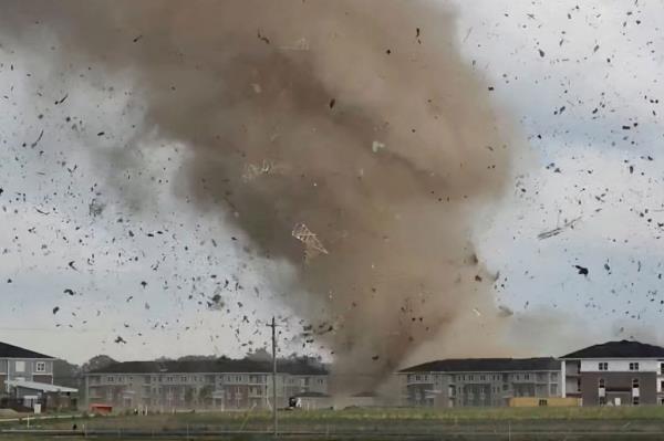 Debris is lifted into the air by a tornado near Greenwood, Indiana, on June 25, 2023. 