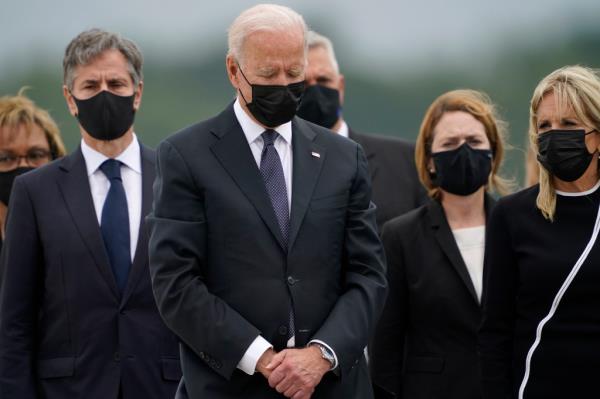 President Biden is seen second from left alo<em></em>ngside Secretary of State Antony Bl<em></em>inken (far left) and First Lady Jill Biden (far right) at the dignified transfer ceremony at Dover Air Force ba<em></em>se on Aug. 29, 2021.