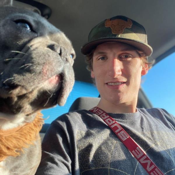 Reid Grotewold is pictured with one of his french bulldog companions.