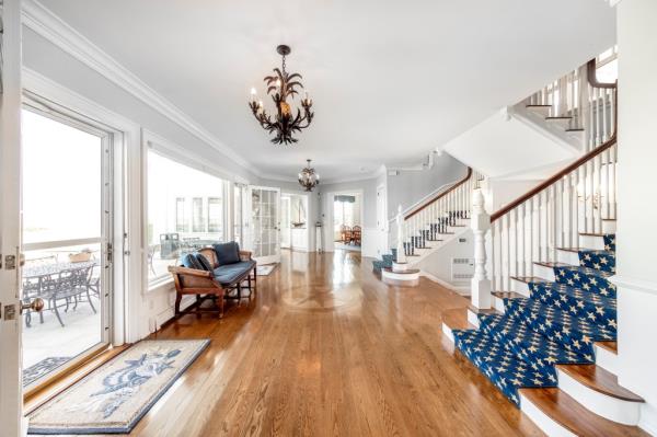 The 9,629-square-foot mansion, with eight bedrooms, offers expansive views of Nantucket Sound from nearly every room, thanks to high ceilings, oversized windows, and classic architectural details.