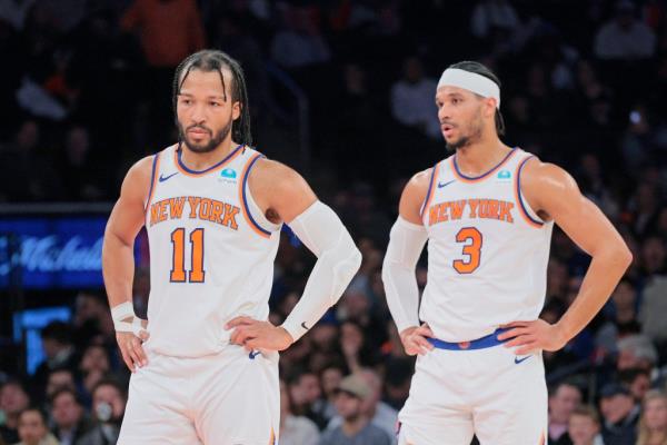 Jalen Brunson #11 and New York Knicks guard Josh Hart #3 react on the court during the second quarter.