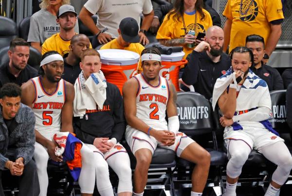 Precious Achiuwa #5, Do<em></em>nte DiVincenzo #0, Miles McBride #2, and Jalen Brunson #11 of the New York Knicks react as they sit on the bench during the fourth quarter.