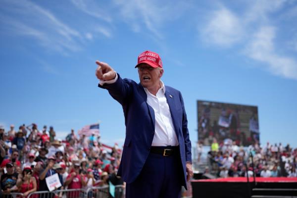 Republican presidential candidate, former President Do<em></em>nald Trump motions to the crowd after speaking at a campaign rally Sunday, June 9, 2024, in Las Vegas. 