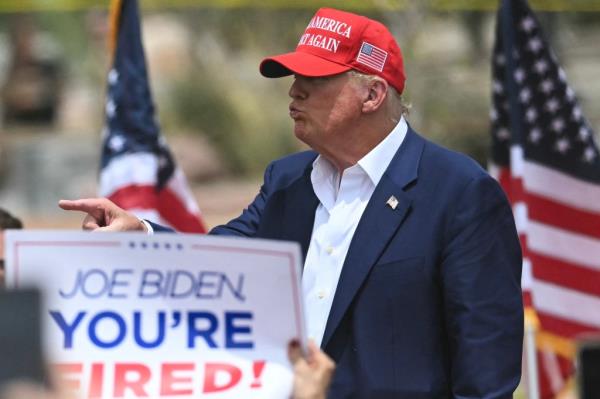 Do<em></em>nald Trump gestures to the crowd after speaking during a campaign rally at Sunset Park in Las Vegas, Nevada on June 9.