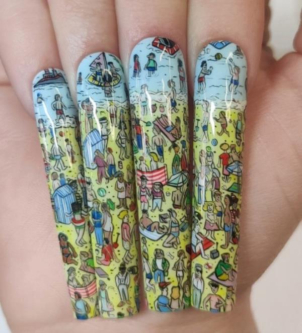 Kassie Payne's Wher<em></em>e's Wally nail set. Photo released September 28 2023. See SWNS story SWTPnails. A mum-of-one who quit her job to become a nail artist says trolls say her ?900 sets are overpriced ? but she says they?re collectable art. Kassie Payne, 34, paints elaborate portraits o<em></em>nto press-on nails, sometimes as small as just three centimetres. Her most intricate designs can take up to 45 hours to complete. The mum says trolls tell her no one would pay ?900 a set for fake nails - but she hits back by explaining they?re collectable art pieces.