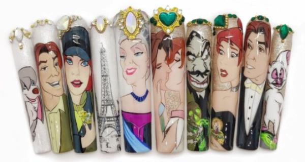 Kassie Payne's Disney nail set. Photo released September 28 2023. See SWNS story SWTPnails. A mum-of-one who quit her job to become a nail artist says trolls say her ?900 sets are overpriced ? but she says they?re collectable art. Kassie Payne, 34, paints elaborate portraits o<em></em>nto press-on nails, sometimes as small as just three centimetres. Her most intricate designs can take up to 45 hours to complete. The mum says trolls tell her no one would pay ?900 a set for fake nails - but she hits back by explaining they?re collectable art pieces.