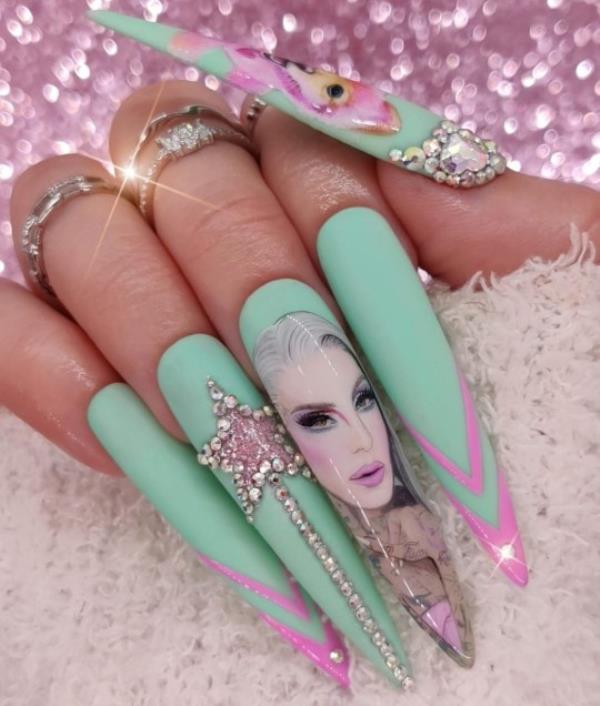 Kassie Payne's Jeffree Star nail set. Photo released September 28 2023. See SWNS story SWTPnails. A mum-of-one who quit her job to become a nail artist says trolls say her ?900 sets are overpriced ? but she says they?re collectable art. Kassie Payne, 34, paints elaborate portraits o<em></em>nto press-on nails, sometimes as small as just three centimetres. Her most intricate designs can take up to 45 hours to complete. The mum says trolls tell her no one would pay ?900 a set for fake nails - but she hits back by explaining they?re collectable art pieces.