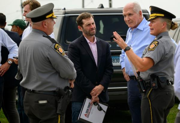 Rep. Jason Crow (D-CO) and U.S. Rep. Mike Kelly (R-PA), both ranking members of the Task Force on the Attempted Assassination of Do<em></em>nald J. Trump, discuss plans with Pennsylvania State Troopers to tour of the shooting site at the Butler Farm Show Grounds on August 26, 2024 in Butler, Pennsylvania.