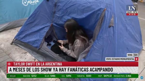 Swiftie in tent outside