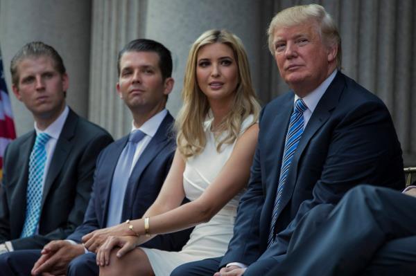 Do<em></em>nald Trump sits with kids Eric, Don. Jr. and Ivanka.