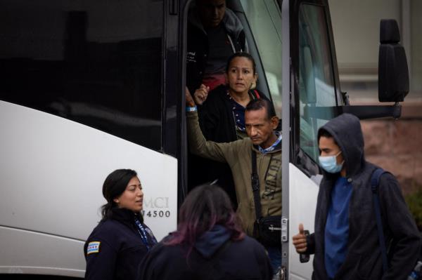 Migrants getting off a bus in Chicago.