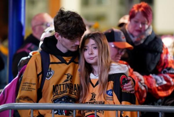 Fans gather outside the Motorpoint Arena, Nottingham, ahead of a memorial for Nottingham Panthers' ice hockey player Adam Johnson. Adam Johnson died after an accident during a Challenge Cup match with Sheffield Steelers last Saturday. Picture date: Saturday November 4, 2023. PA Photo. See PA story ICEHOCKEY Nottingham. Photo credit should read: Zac Goodwin/PA Wire.