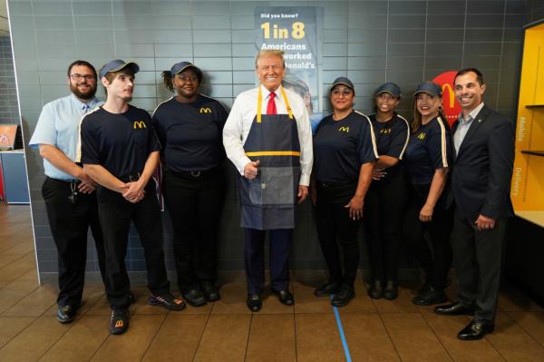 Trump poses with employees during a visit to McDonald's in Feasterville-Trevose, Pa.