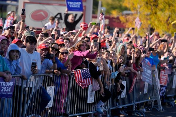 Supporters of Republican presidential nominee former President Do<em></em>nald Trump cheer outside of a McDonald's in Feasterville-Trevose, Pa.