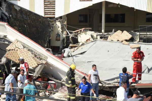 Rescue workers search for survivors amid debris after the roof of a church collapsed during a Sunday Mass in Ciudad Madero, Mexico, on Oct. 1, 2023. 