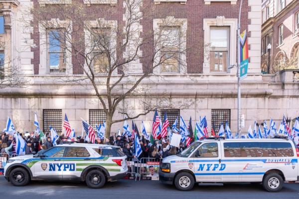 NYPD looked on while several hundred protesters occupied the sidewalk.