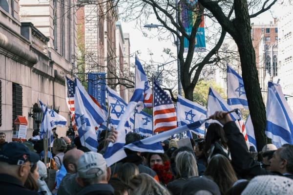 Pro-Israel supporters waving American and Israeli flags outside Columbia's campus.