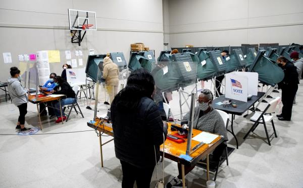 People casting their ballots at Victory Houston polling station, a 24-hour location, during the general election in Houston, Texas, on October 30, 2020.