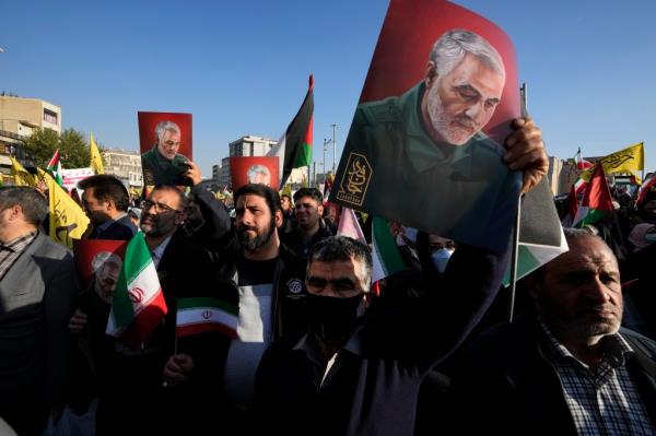 Iranian demo<em></em>nstrators hold posters of the llate Qassem Soleimani during a pro-Palestinian rally in Tehran, Iran on Nov. 18, 2023.