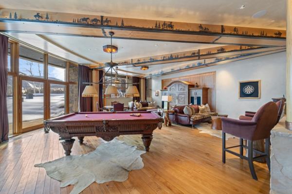 The highest bidder can even get this billiards room.