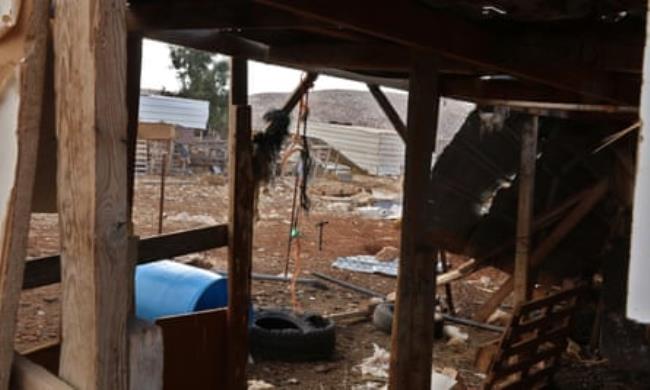 The abando<em></em>ned village of Wadi a-Seeq – empty animal sheds and buildings with loose sheets of corrugated iron, an upturned plastic barrel and torn vehicle tyres on the ground