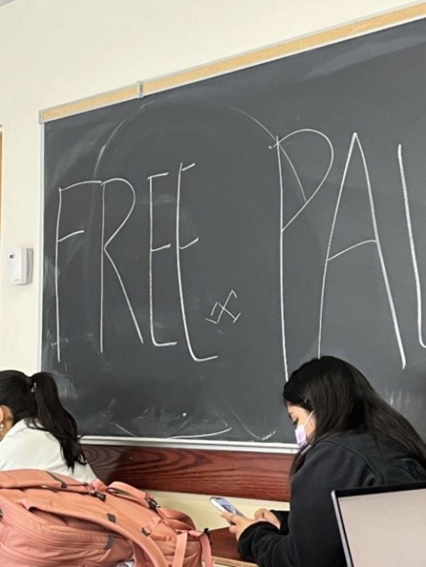 Students studied by a blackboard with the words 