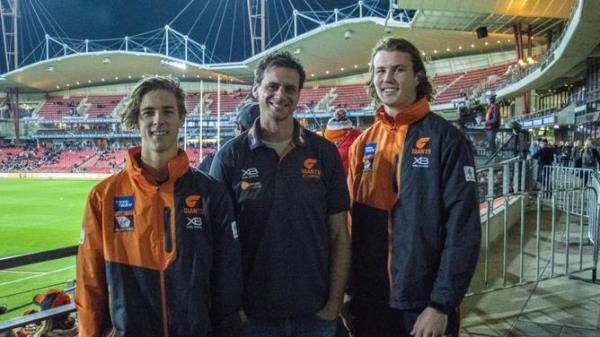 Giants academy members James Peatling (left) and Kieren Briggs (right) as teenagers with lo<em></em>ngtime academy head Jason Saddington. GWS Giants