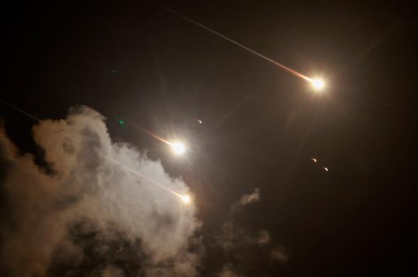 Projectiles are seen in the sky after Iran fired a salvo of ballistic missiles, amid cross-border hostilities between Hezbollah and Israel, as seen from Tel Aviv, Israel, October 1, 2024. 