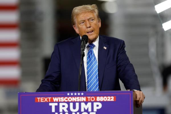 Former US President and Republican presidential candidate Do<em></em>nald Trump speaks during a campaign event at Dane Manufacturing in Waunakee, Wisconsin, on October 1, 2024.